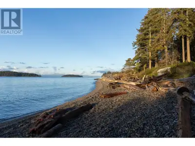 Set on 2.1 acres of pristine Sunshine Coast waterfront with 300 feet of direct oceanfront, this high...