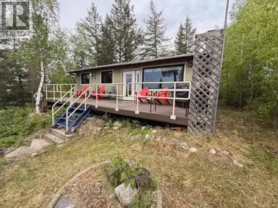 This charming lakefront cabin is truly move-in ready, just launch the boat and start making memories...