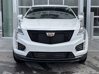 The 2026 Cadillac XT5 Sport AWD, finished in Crystal White Tricoat with a rich Kona Brown interior w... (image 1)