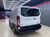 The 2024 Ford Transit Cargo Van T-250 130 Low Rf 9070 GVWR AWD in pristine white is a formidable veh... (image 5)