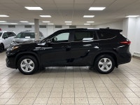 The citys lights ripple across wet pavement as the Midnight Black Metallic finish glides past, its L... (image 2)