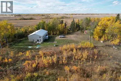 Very Private 15+/- acre property with newer 40X60 Shop/House located North East or Rycroft AB. Yard...