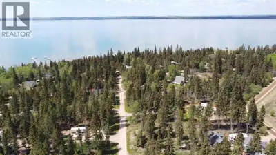 RVs allowed with a permit at this Lake Lot. Buy now and get a few trees cleared so you can park the...