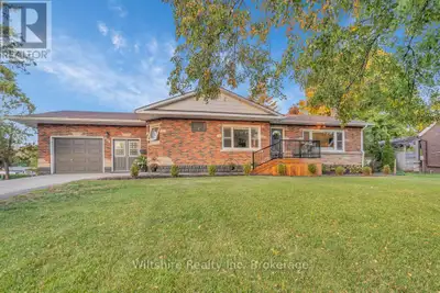 This charming brick bungalow has been tastefully updated to offer a fresh, modern feel while keeping...
