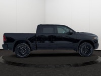 This 2026 RAM 1500 REBEL CREW CAB 4X4 has the following options Lux Leather Trimmed Bucket Seats, Re... (image 5)