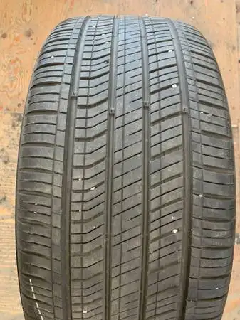 a nice all season Kumho tire in good shape with lots of tread (1 TIRE ONLY) size 235 40 18 235/40/18...