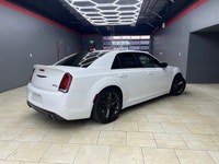 The 2023 Chrysler 300, particularly the 300C RWD in pristine white, is a powerful sedan that truly s... (image 7)