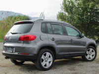 The 2012 Volkswagen Tiguan Highline in its sophisticated gray hue, paired with an agile AWD drivetra... (image 2)