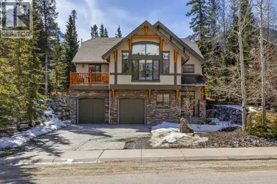 5 bedrooms, with legal suite - this is an exceptional custom-built home in prestigious Three Sisters...