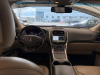 The 2016 MKX Reserve is characterized by its "Split-wing" front grille and a full-width LED taillamp... (image 9)