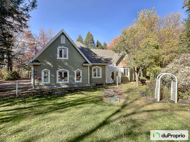 $997,000 - Bungalow for sale in Ste-Anne-Des-Lacs — photo 1