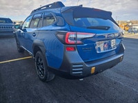 The 2022 Subaru Outback Wilderness in a striking blue finish with an all-wheel-drive system is your... (image 7)
