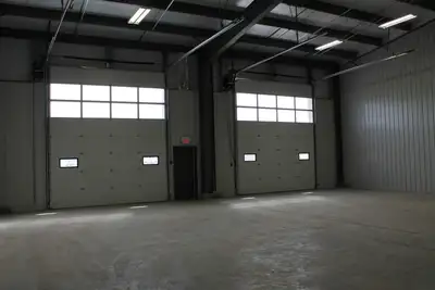 POWER OVERHEAD DOORS 11 BAYS MULTIPLE SIZES Our Rocky Mountain House, Alberta building has a total w...
