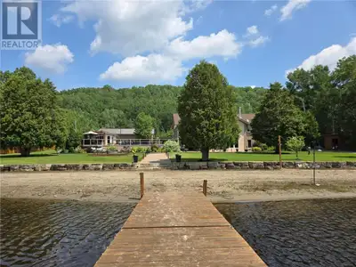 This executive style waterfront estate is located on the north shore of Onwatin Lake in Hanmer. Nest...