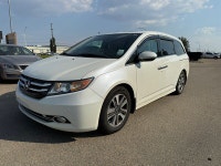 2014 Honda Odyssey Touring — White exterior, Brown interior. This Odyssey is powered by a 3.5L V6 th... (image 2)