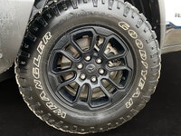 This *2025 Ram 1500 Rebel Crew Cab 4x4* in *Bright White* represents the newest chapter of Ram perfo... (image 6)