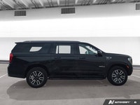 Experience the premium capability and rugged refinement of the 2023 GMC Yukon XL AT4. This used full... (image 6)