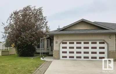 LUXURIOUS ADULT LIVING — WITHOUT THE FEES! This beautifully maintained 3-bedroom bungalow style half...