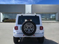 The 2024 Jeep Wrangler 4xe High Altitude 4 Door blends open-air freedom with plug-in hybrid power in... (image 7)