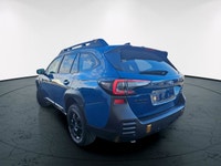 The 2022 Subaru Outback Wilderness in a striking blue finish with an all-wheel-drive system is your... (image 1)