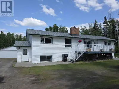 This four bedroom and two bathroom family home has vaulted ceilings and great open concept layout. S...