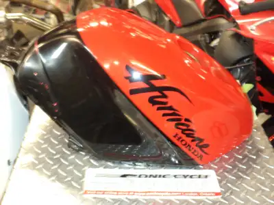sonic cycle has a 1987 - 1990 honda cbr - 600 f-1 hurricane gas tank very nice cond. mint inside red...