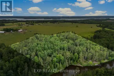 WATERFRONT ACREAGE! Discover over 13 acres of private Bonnechere River waterfront featuring approxim...