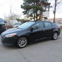 This 2016 Ford Focus SE is a reliable sedan with a sleek black exterior and a stylish charcoal inter... (image 3)