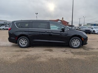 The 2026 Chrysler Grand Caravan SXT in Diamond Black Crystal Pearl with a Black interior combines fa... (image 7)