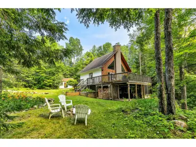 Turnkey waterfront retreat on beautiful Lac Rhéaume! Set on a private, level 2-acre south-facing lot...