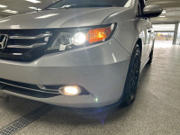 Our used family-friendly 2014 Honda Odyssey Touring is shown in stunning Alabaster Silver Metallic.... (image 8)