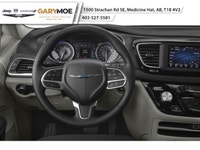 The 2026 Chrysler Grand Caravan SXT in a captivating black hue is the front-wheel drive van designed... (image 3)