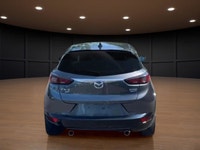 Get ready to conquer the roads with the 2022 Mazda CX-3 GT, a sophisticated gray SUV that combines a... (image 6)
