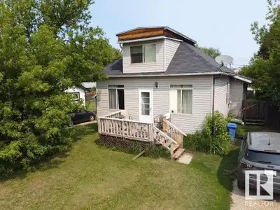 Investors & Buyers—this is the one! Tucked away on a quiet street in a desirable Wetaskiwin neighbor...