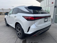 Curbside, this 2026 Lexus RX350h Premium expresses its sophisticated style with a sleek body design... (image 1)