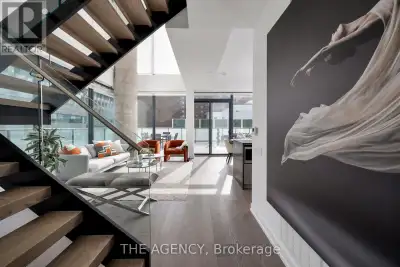 Welcome to an absolutely exquisite modern two-storey corner residence, showcasing floor-to-ceiling w...