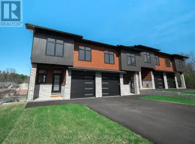 This newly constructed walk executive style townhome with a walkout basement with 3 bedrooms and 4 b...
