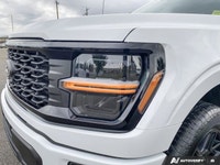 The 2024 Ford F-150 STX in a striking white finish is the perfect blend of power and practicality. I... (image 7)