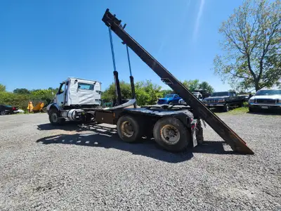 2003 Volvo Straight Truck VHD with Roll-off bin system. VED 12 diesel engine, runs good, no lights o...