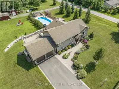 Wake up every morning to breathtaking views of Lake Ontario in this custom-built bungalow that blend...
