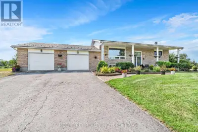 This beautifully 2 acre landscaped elevated bungalow with mature trees, conveniently located just ou...