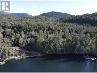 Stunning waterfront acreage in Hidden Basin, Nelson Island! One of the very best lots in the area, t...