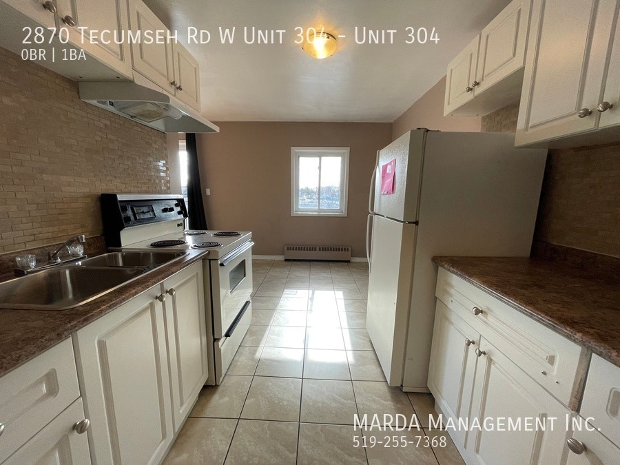 SPACIOUS BACHELOR UNIT NEAR HURON CHURCH! + Utilities 3