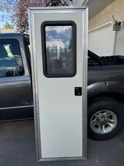 Selling a brand new rv door standard size square build inc. lock and keys for $545..00 70.5 inches t...