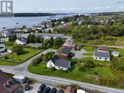 Positioned in a prime location near Fishermans Cove, this versatile corner-lot property offers incre...