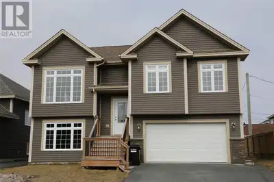 : Three-bedroom, two bathroom split entrance with a garage boasts an open concept living room and ki...