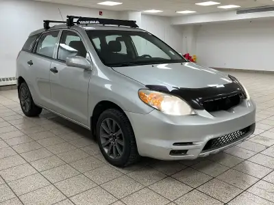 Silver light glances off the Titanium Metallic paint as it moves, the compact hatchback shape cuttin...