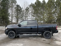 Meet the 2023 RAM 2500 Big Horn 4x4 Crew Cab 6'4 Box with the Night Edition package, offered by Hald... (image 9)