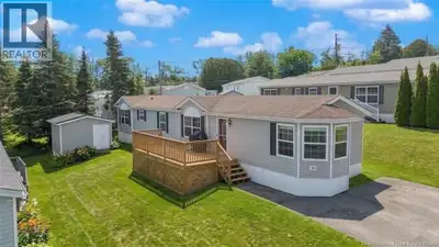 Welcome to this charming mini home in Nethervue Park! Perfectly blending comfort and scenic living....