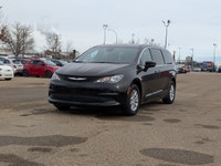 The 2026 Chrysler Grand Caravan SXT in Diamond Black Crystal Pearl with a Black interior combines fa... (image 1)